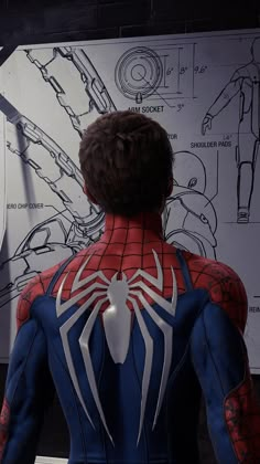 the amazing spider - man is standing in front of a drawing