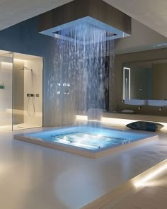 a bathroom with a large bathtub and shower head in the middle of the room