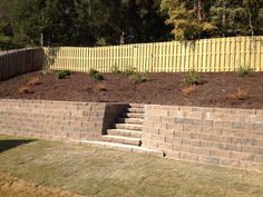 a retaining wall with steps leading up to it