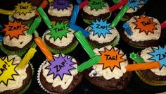 cupcakes decorated with comic themed icing and colorful sprinkles on top