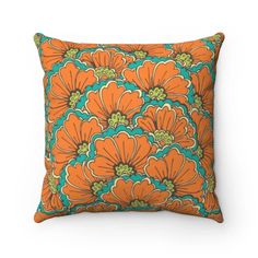 an orange and green floral pillow on a white background with the word,'flower power '