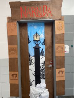 the door to marda is decorated with paper towels and a lamppost on it