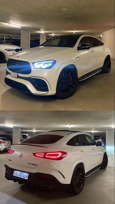 two different cars parked in a parking garage, one is white and the other is blue