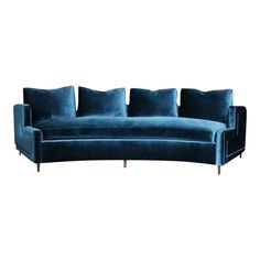 a blue couch with four pillows on it's back and two arms, sitting in front of a white background