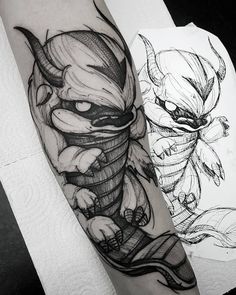 a black and white photo of a tattoo on the arm with an image of a demon