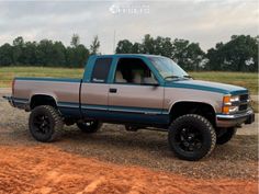 a truck parked on top of a dirt field