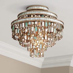 a chandelier hanging from the ceiling in a room