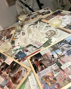 a table topped with lots of pictures and wine glasses on top of it's sides