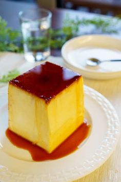 a piece of cheesecake on a plate with sauce