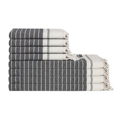 four towels stacked on top of each other in black and white stripes, with one folded up