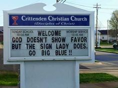 a sign that is in front of a church saying welcome to god doesn't show flavor but the sign lady does go big blue