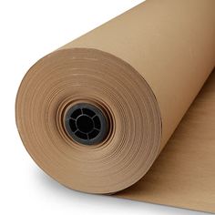 a roll of brown paper sitting on top of a white surface