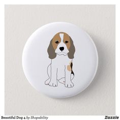 a white and brown dog sitting on top of a button