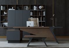 an office desk in front of a bookcase with shelves and a laptop on it