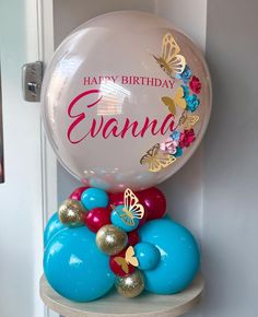 a birthday balloon sitting on top of a shelf