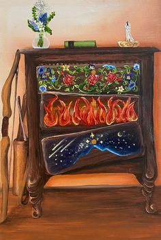 a painting of an old dresser with fire and flames on the front, next to a vase filled with flowers