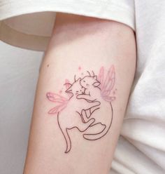 a small tattoo on the arm of a woman