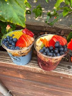 two cups filled with different types of fruit