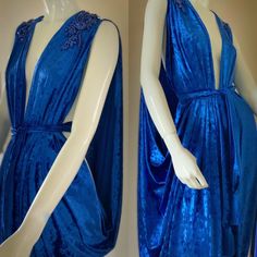 Handmade in our small exclusive studio in Portland Oregon. Indulge in the timeless elegance of our exquisite draped velvet Grecian gown, crafted from luxurious materials for a regal and goddess-like look.  The flowing design features intricate draping and a body-flattering silhouette, perfect for any formal occasion.  The soft rich crushed velvet  in a vibrant royal blue adds a touch of sophistication and luxury, while the Grecian-inspired details bring a touch of ancient glamour. Spectacular sparkling rhinestone appliqués on shoulders bring the bling for a one of a kind look!  This versatile gown can be worn in a number of different ways from a modest look to a more daring evening style. Pair with the matching turban, statement jewelry and heels for a look that's both dramatic and allurin Luxury Velvet Wedding Dress, Fitted Velvet Dress With Traditional Drape, Blue Greek Goddess Dress, Celtic Dresses, Velvet Midevil Dress, Medieval Blue Dress Aesthetic, Blue Velvet Fantasy Dress, Blue Medieval Gown, Grecian Gown