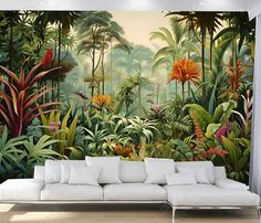 a living room with a white couch and large mural on the wall in front of it