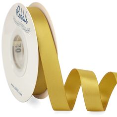 a roll of gold satin ribbon is shown with the word,'i love you'on