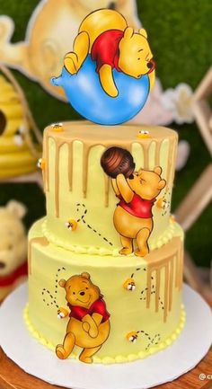 a winnie the pooh birthday cake on a table