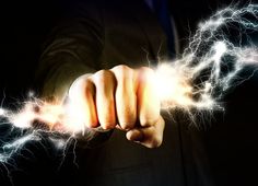 a man in a suit holding out his hand with lightning bolts coming out of it