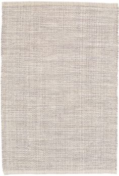 a white rug with small squares on the bottom and one square in the middle, against a