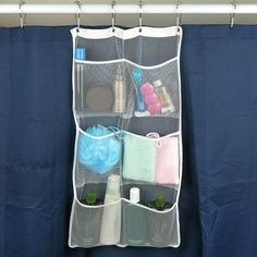 an over the door organizer hanging on a shower curtain with toiletries and other items in it