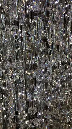 many crystal beads are hanging from the ceiling