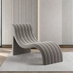 a chair sitting on top of a rug in front of a wall with vertical blinds