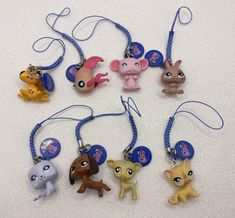 the littlest pet shop keychains have been made to look like cartoon characters