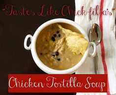 chicken tortilla soup in a white bowl on a red and white striped towel