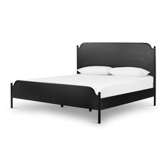 a bed with white pillows and black headboard is shown in front of a white background