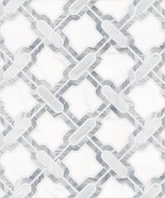 a white and grey tiled wallpaper with an intricate design