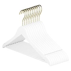 white plastic suit hangers with gold pins on each side and four rows of long, wavy