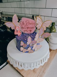 there is a cake that has butterflies on it