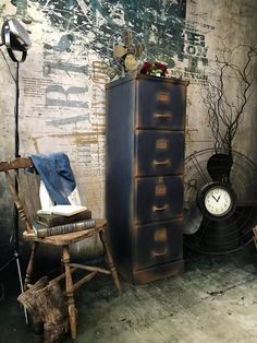 an old dresser and chair in a room