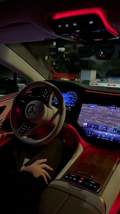 the interior of a car with an electronic display on the dashboard and touchscreens