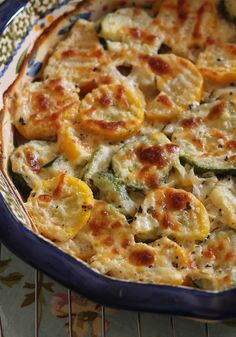 a casserole dish with zucchini and squash