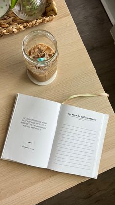 an open book sitting on top of a wooden table