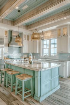 a large kitchen with an island and two stools