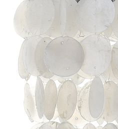 a group of white discs hanging from the ceiling