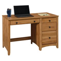 a laptop computer sitting on top of a wooden desk in front of a white background