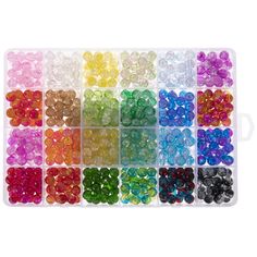 a tray filled with lots of different colored beads