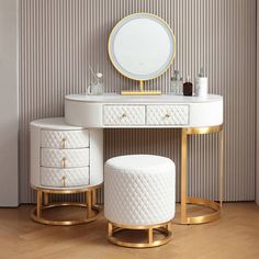 a white vanity with two stools and a round mirror on the wall behind it