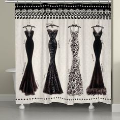 the shower curtain is decorated with black and white gowns on it's sides