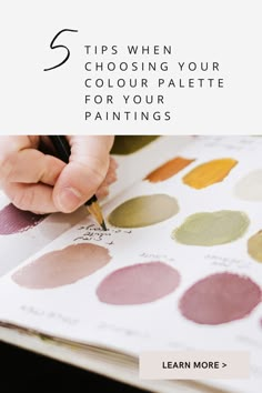 a person writing on paper with the words 5 tips when choosing your color palette for your paintings