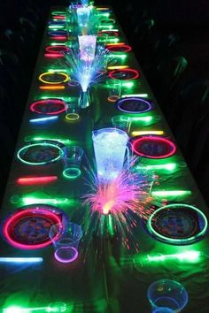 a long table covered in lots of colorful lights