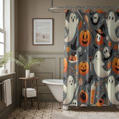 a halloween themed shower curtain with ghost and pumpkins on it in a gray bathroom